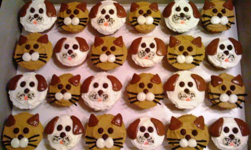 Cupcakes with dog and cat face on them